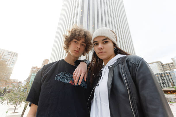 istock A young couple looking seriously at camera in the city 1392570221