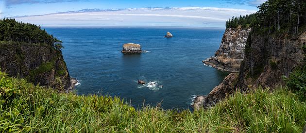 Cape Meares is a small headland on the Pacific coast in Tillamook County, Oregon, United States. The cape forms a high steep bluff on the south end of Tillamook Bay, approximately five miles (8 km) northwest of the city of Tillamook. Much of the cape is part of the Oregon Parks and Recreation Department-administered Cape Meares State Scenic Viewpoint.