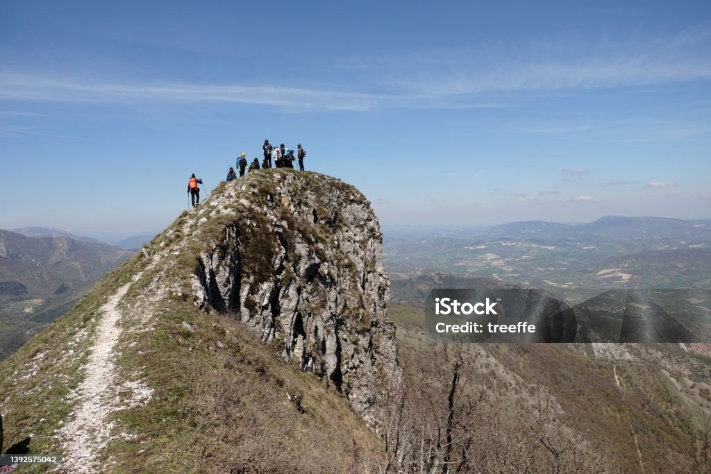 Hiking adventure Small group of hikers on the top of a mountain Marche - Italy Stock Photo