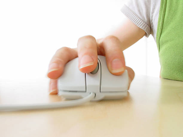 istock Close up photograph of a hand on a computer mouse  139257597