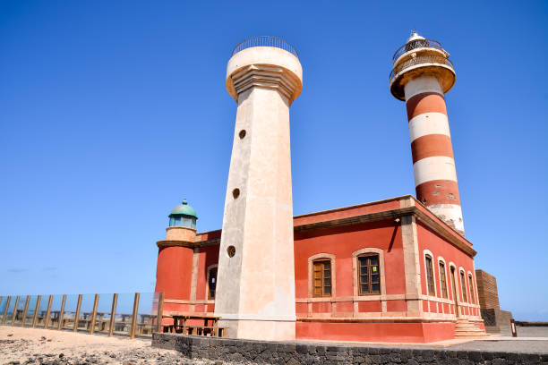 istock lighthouse and blue sky, digital photo picture as a background 1392577552