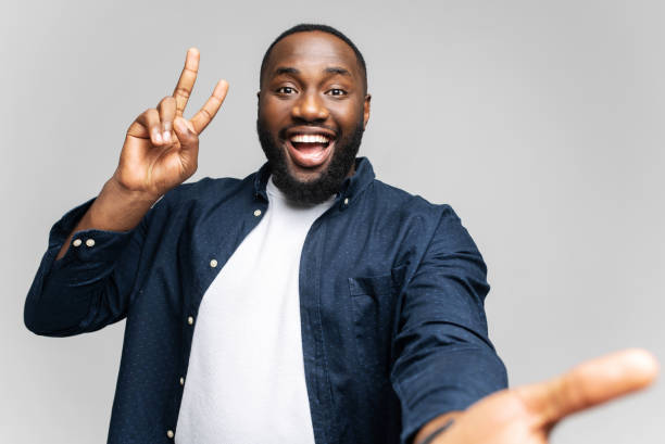 istock Hilarious young African-American man smiling and looking at camera 1392578645