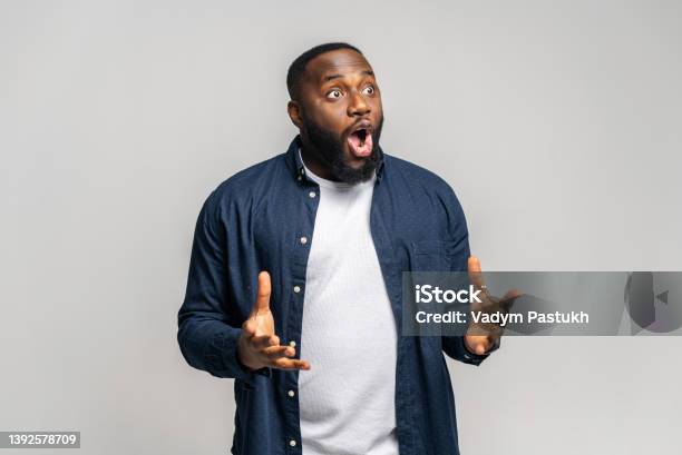 Shocked Africanamerican Guy Staring Away With Awe Expression Stock Photo - Download Image Now