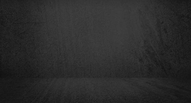 istock dark black slate empty room with light from above used for background and display your product. vintage distressed smooth texture and dark gray charcoal color paint. 1392579191