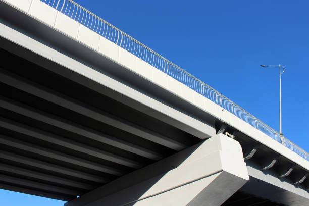 istock Automobile bridge close up on blue sky background 1392580123