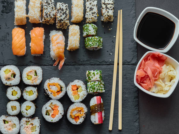 istock Various nigiri and maki sushi on a slate. 1392581279