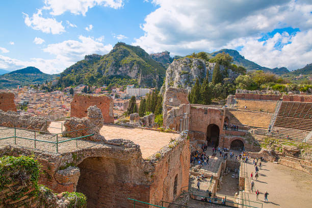 Ancient theatre in Taormina, Sicily. Beautiful pamoramic view in sunny summer day.