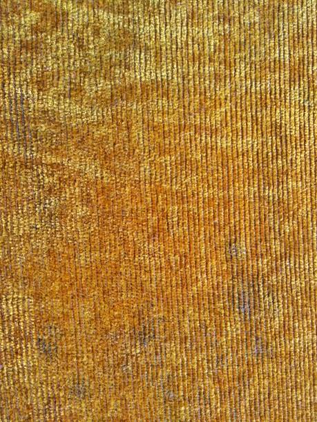istock Closeup yellow fiber textiles pattern background abstract 1392583186