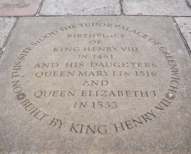 Site of Greenwich Palace An engraved paving slab marking the place where the old Palace of Greenwich once stood. It reads ‘On this site stood the Tudor Palace of Greenwich - Built by King Henry VII - Birthplace of King Henry VIII in 1491 and his daughters Queen Mary I in 1516 and Queen Elizabeth I in 1533’. The plaque is in the grounds of the Old Royal Naval College beside the River Thames in Greenwich, London. elizabeth i of england photos stock pictures, royalty-free photos & images