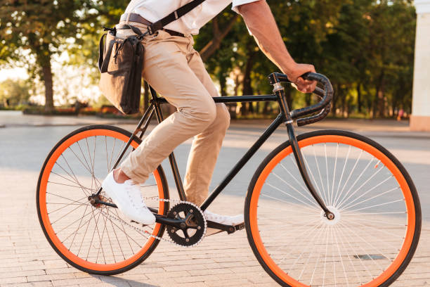 istock Handsome young african man early morning with bicycle 1392584650