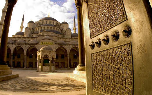 A daytime wide angle exterior shot of the Blue Mosque in Istanbul, Turkey. Shot through a doorway with Absolutions Fountain in front of the mosque, May 2004. Photograph by Stacy Munn.