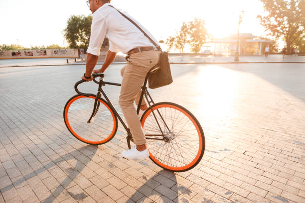 istock Handsome young african man early morning with bicycle 1392585863