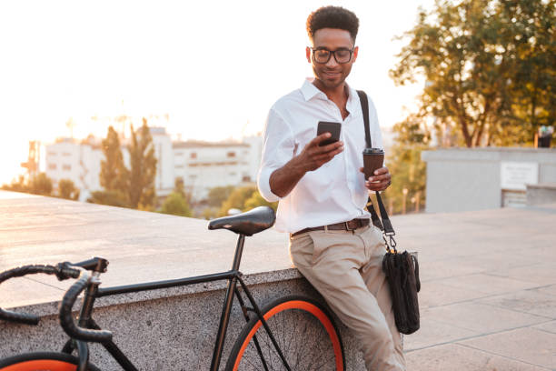 istock African man early morning standing near bicycle 1392585918