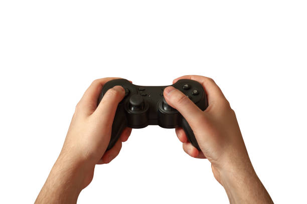 istock A man plays holding a joystick on a white background. Isolated 1392586030