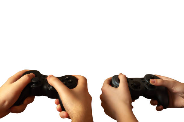 Two people are playing, holding joysticks on a white background. Isolated.