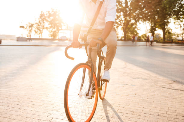 istock Handsome young african man early morning with bicycle 1392586310