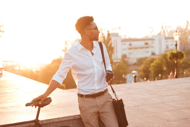 istock Concentrated young african man early morning with bicycle 1392586396