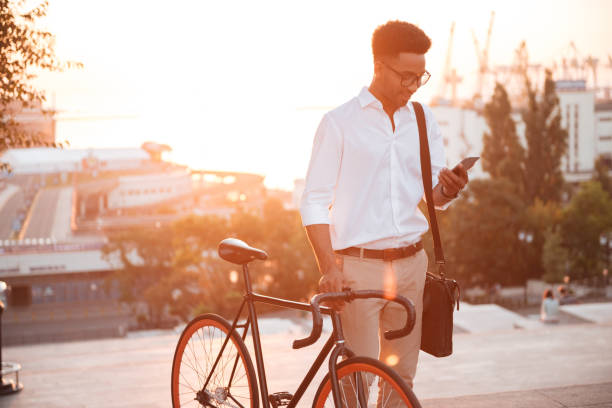 istock African man early morning standing near bicycle 1392586546