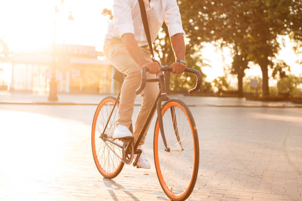 istock Handsome young african man early morning with bicycle 1392586614