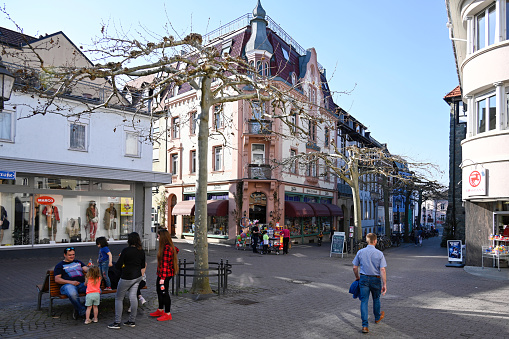 Radolfzell, Germany, March 27, 2022 - Traditional toy store in Radolfzell on Lake Constance, some unidentified people in the background