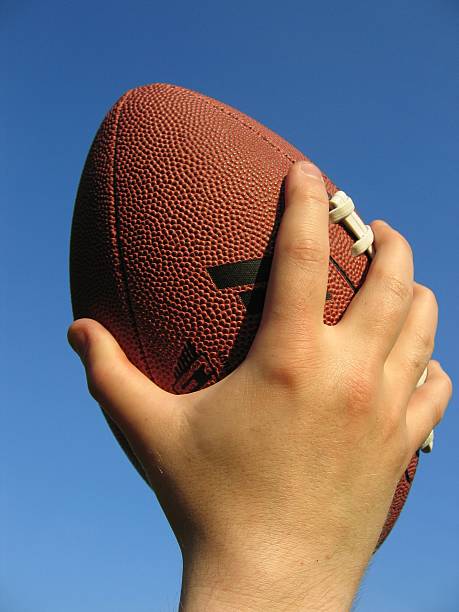 istock Football in Hand 139258746