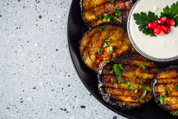 istock grilled eggplant on Georgian on a gray stone background 1392587501