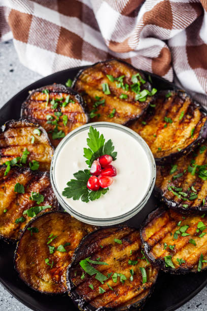 istock grilled eggplant on Georgian on a gray stone background 1392587796