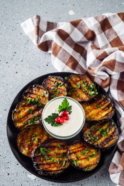 istock grilled eggplant on Georgian on a gray stone background 1392588758