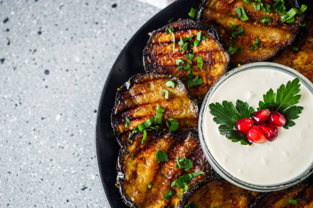 istock grilled eggplant on Georgian on a gray stone background 1392589022