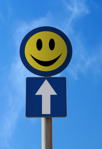 Smiley traffic sign. An optimistic idea - happiness ahead.
