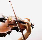 Partial close-up of a violin being played during interlude