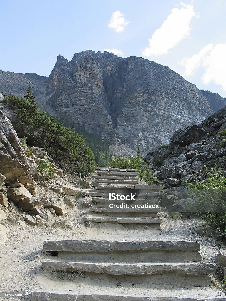 A Step Toward Heaven Rock Stairway leading to the base of a mountain Development Stock Photo