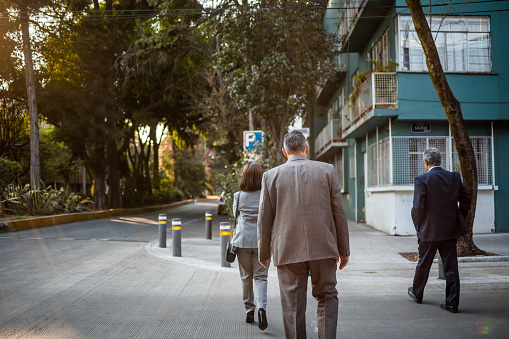 Business partners waking down the city street