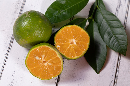 Rangpur, Citrus × limonia or Citrus reticulata × medica, sometimes called the rangpur lime, mandarin lime or lemandarin, is a hybrid between the mandarin orange and the citron.