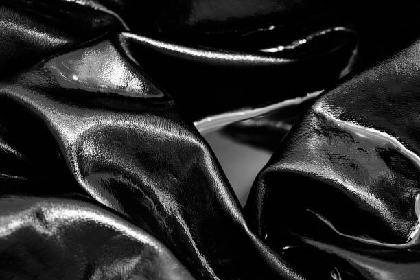 istock black faux laether clothing in water textured background 1392598296