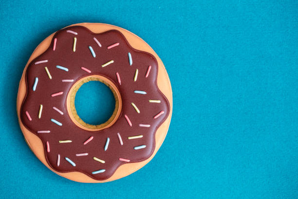 Gingerbread in form of iced doughnut for design purpose