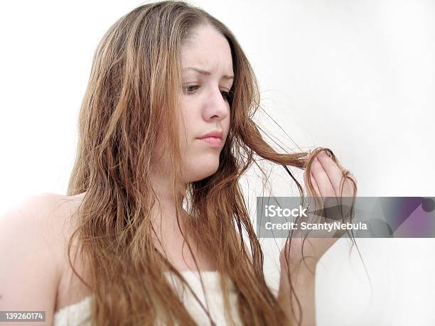 Woman In Towel Looking Disgruntled At Damaged Hair Stock Photo - Download Image Now - Damaged, Human Hair, Adult