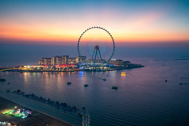 Photo of Bluewaters island leisure spot in Dubai with large Ferris wheel seen from JBR beach in Dubai Marina area