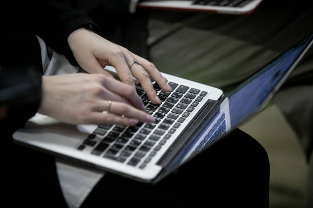 istock Press conference, man, businessman, typing on a laptop 1392602964