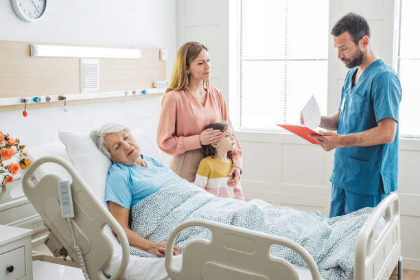 istock Visiting  grandmother at hospital 1392605504