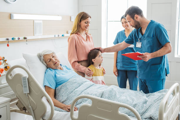 istock Visiting  grandmother at hospital 1392605518