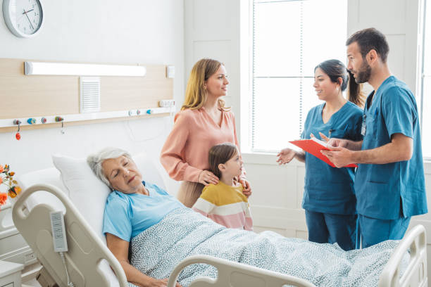 istock Visiting  grandmother at hospital 1392605522