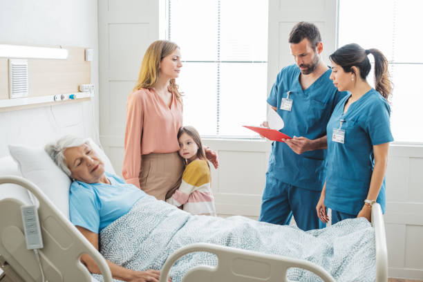 istock Visiting  grandmother at hospital 1392605533