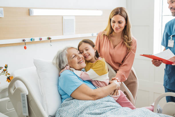 istock Visiting  grandmother at hospital 1392605538