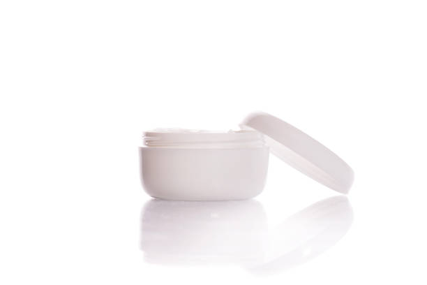 Cosmetic cream in plastic container isolated on white background