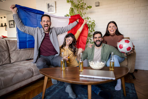 istock fans are watching the  football on TV 1392606799