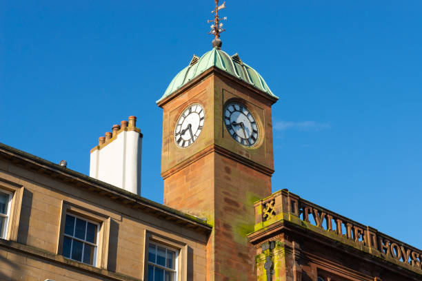 istock Old clock tower in English city. 1392608114