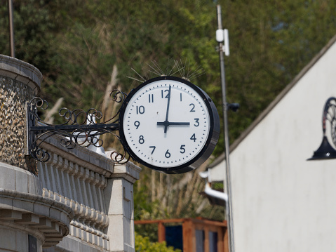 Old Victorian large clock on the prom at Lyme Regis England