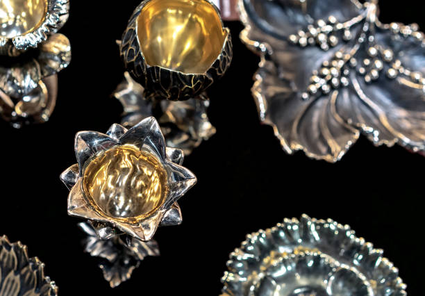 istock Silver candlestick with a gilded center on a black background. 1392609300