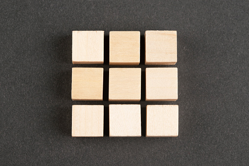 Wooden block cubes on black background